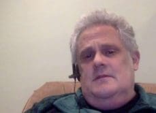 GCA man wearing headset sitting at home