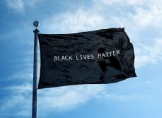 GCA Black Lives Matter Flag waiving in blue sky