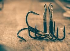 GCA pile of fish hooks sitting on floor