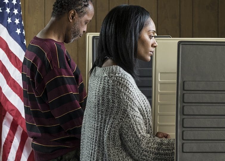 GCA man and woman at the polls