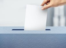 GCA someone dropping an election ballot box