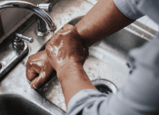 GCA man washing hands in sink