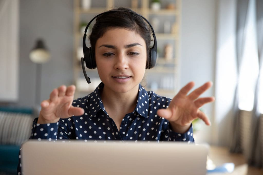 A person on a call at their computer.