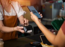 woman with cashpoint system at a small business